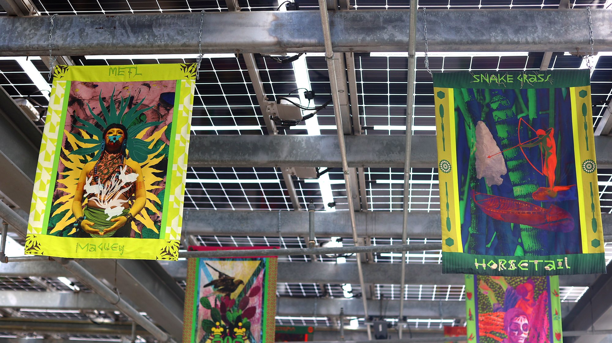 Close-up view of Austin textile installation showing detailed plant name labels and cultural design elements