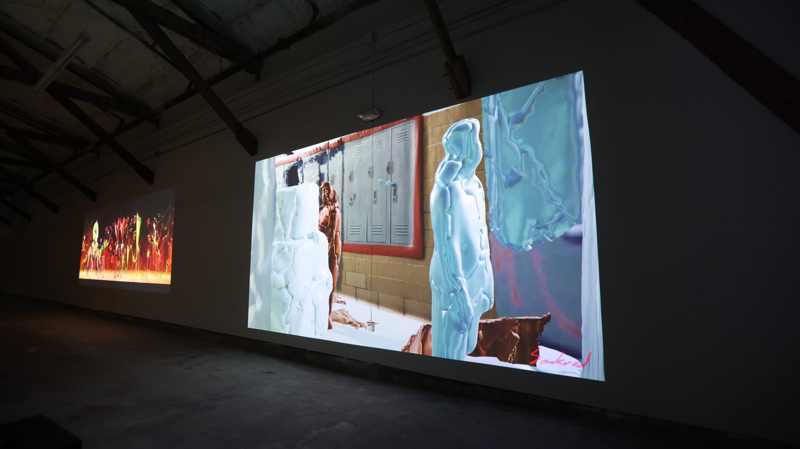 Dual screens with abstract figures and locker-room scene