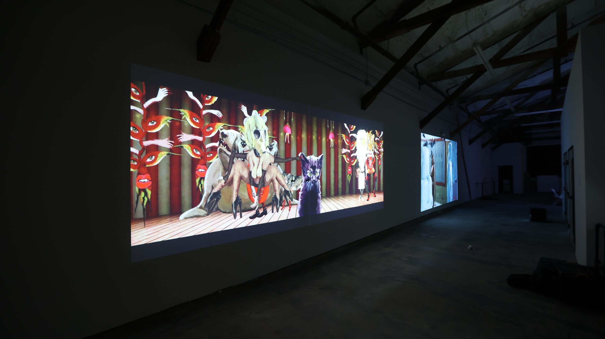 Theatrical panoramic projection with eyes, hands, and animal figures